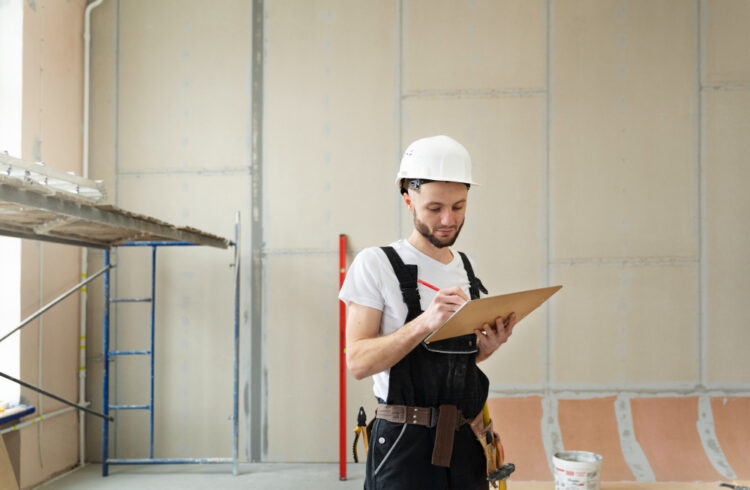 Remodeling expert inspecting interior renovation site